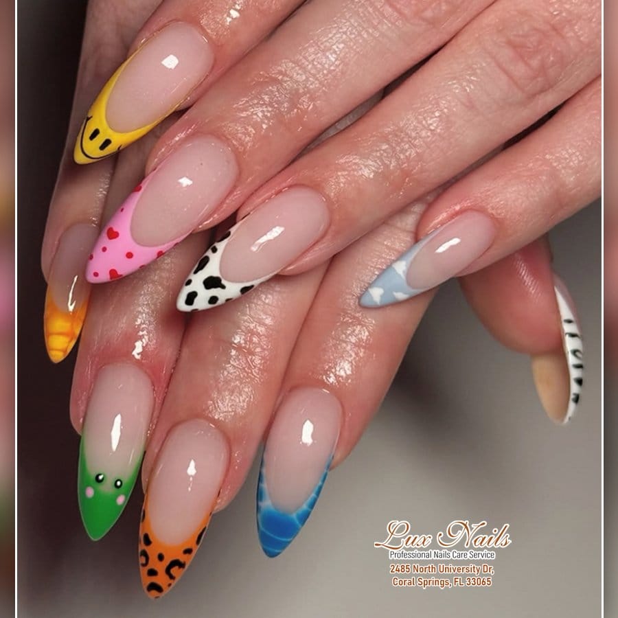 Coral pastel nails with white polka dots