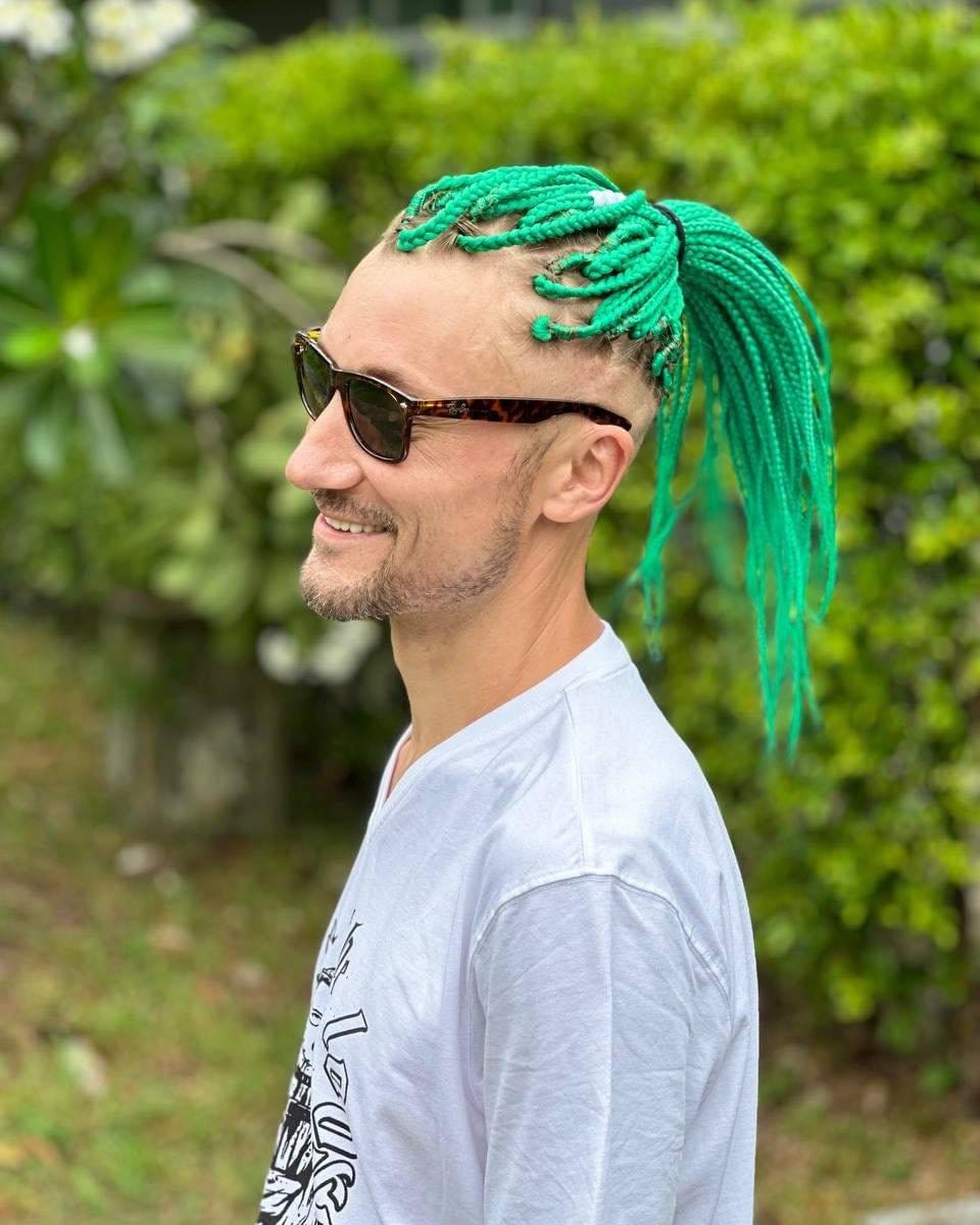 Trendy mohawk dreads with vibrant highlights