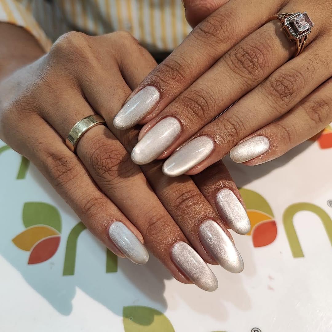 White nails with holographic accents