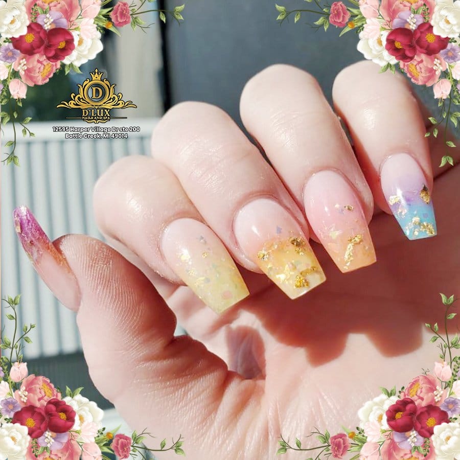 Bright sunflower nail art on emerald background