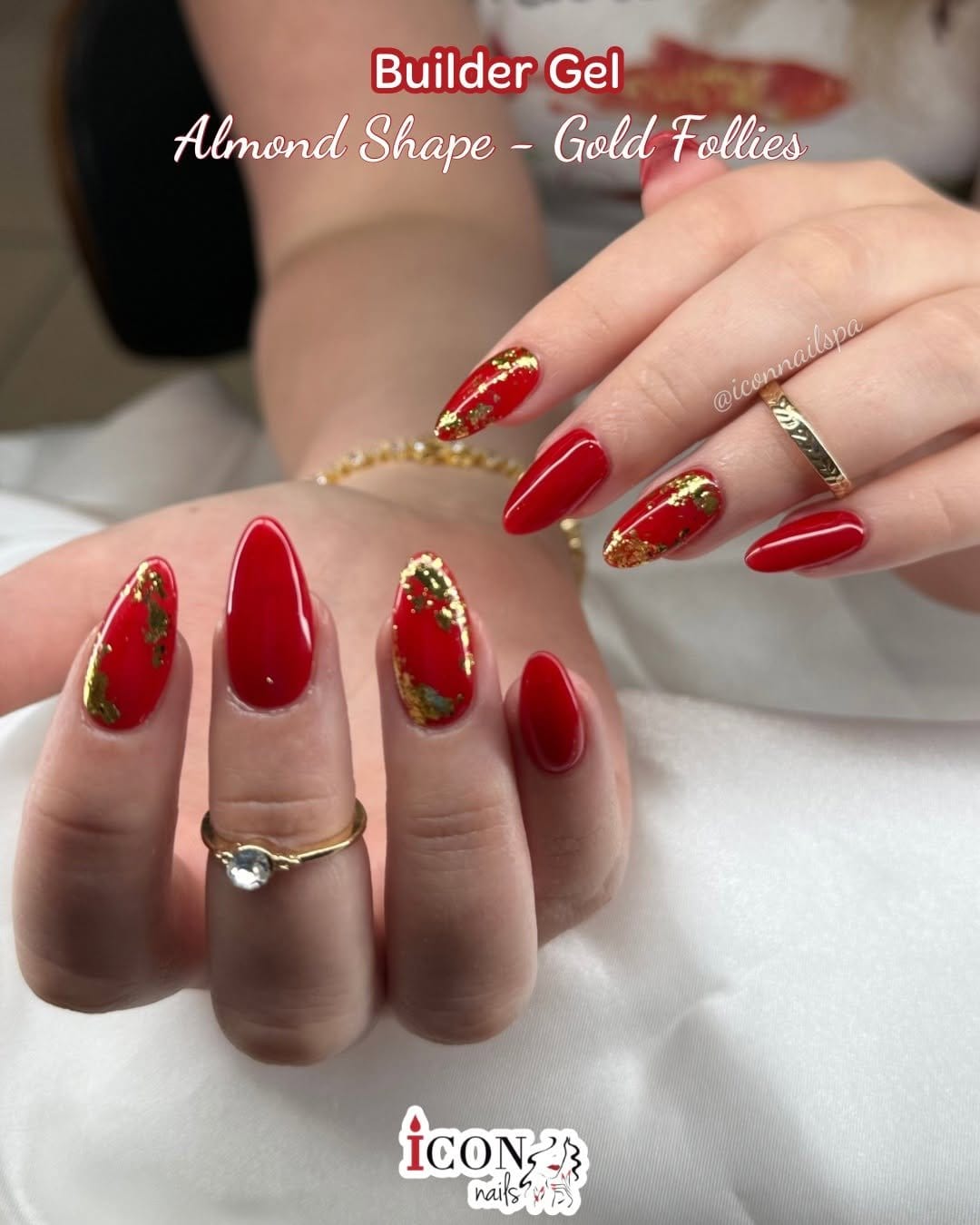 Red nails with metallic foil accents