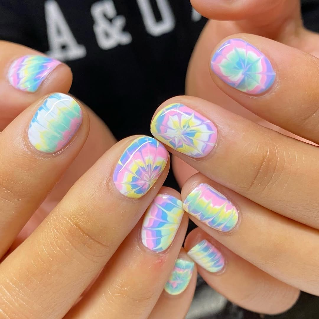 Pastel tie-dye nails with vibrant swirls