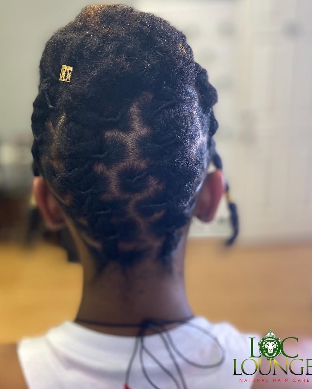 Stylish short locs in an updo